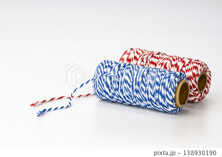Colorful Red White and Blue Striped Baker's Twine Spools on Cardboard Rolls for Wrapping and Decoration 138930190