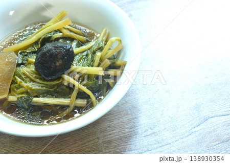 boiled mixed vegetable with mushroom in black soybean soup in bowl on table  138930354
