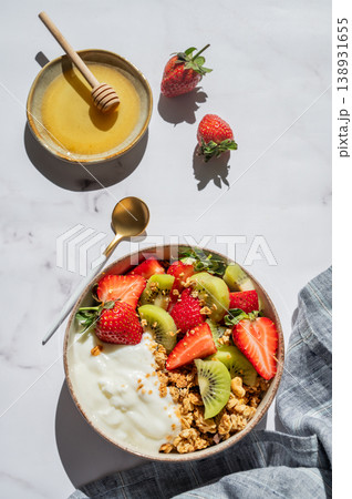 Balanced breakfast with yogurt, granola and fruits, top view with copy space Balanced breakfast with yogurt, granola and fruits, top view with copy space 138931655