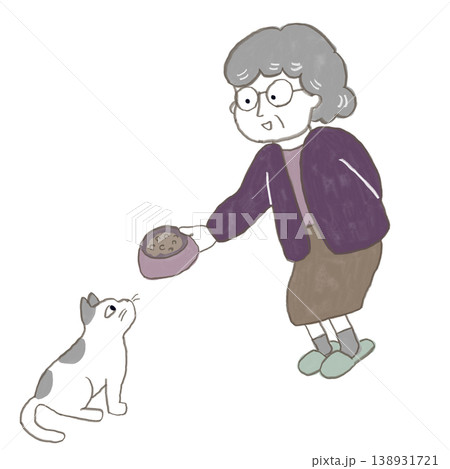 おばあさんがねこに餌をあげている 138931721