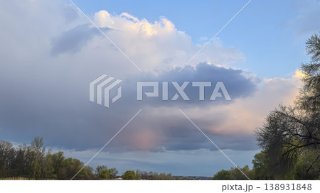 City sky with clouds, spring thunderstorms. Beautiful pink and orange clouds. 138931848