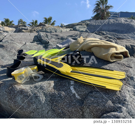 diving equipment lies on a rock near the beach diving equipment lies on a rock near the beach 138933258