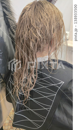 Women's haircut and coloring at the beauty salon. Hair wash. Long blonde hair. Women's haircut and coloring at the beauty salon. Hair wash. Long blonde hair. 138933500