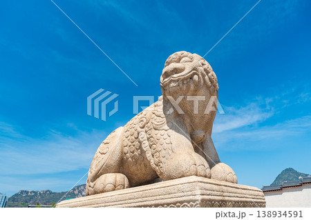 Seoul, South Korea - Apr. 12, 2026 : Haetae Statue and Gwanghwamun Gate under Blue Sky, Seoul, South Korea 138934591