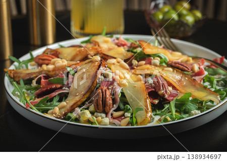 Salad with Pear, Arugula, Jamon, Blue Cheese and Blueberry, Delicious Fresh Salad Appetizer on Bright Background Salad with Pear, Arugula, Jamon, Blue Cheese and Blueberry, Delicious Fresh Salad Appetizer on Bright Background 138934697