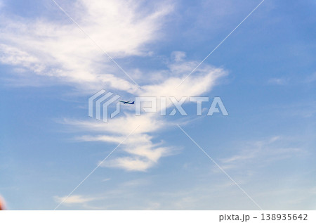 Airplane takes off into a blue sky Airplane takes off into a blue sky 138935642