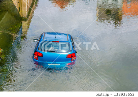 Blue vehicle drown in water canal Blue vehicle drown in water canal 138935652