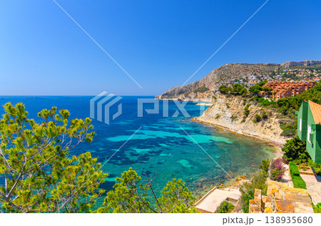 Aerial panoramic view coastline Costa Blanca coast with sandy beach, touristic path, residential houses in Calpe town Aerial panoramic view coastline Costa Blanca coast with sandy beach, touristic path, residential houses in Calpe town 138935680