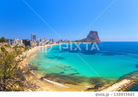 Aerial panoramic view coastline Costa Blanca coast with sandy beach, touristic path, residential houses in Calpe town 138935683
