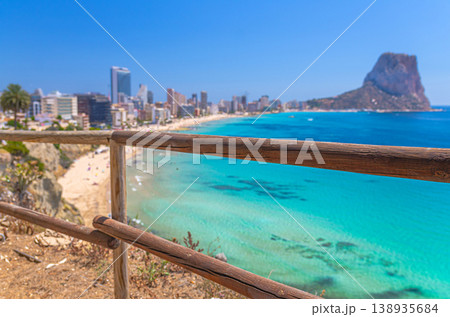 Aerial panoramic view coastline Costa Blanca coast with sandy beach, touristic path, residential houses in Calpe town 138935684