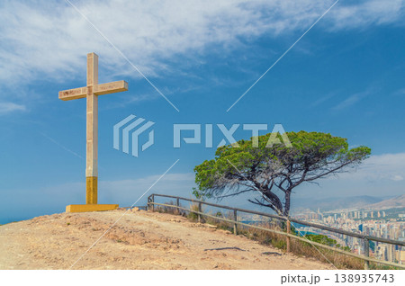 La Cruz de Benidorm La Creu giant cross on mountain hill, aerial view of Mediterranean Sea La Cruz de Benidorm La Creu giant cross on mountain hill, aerial view of Mediterranean Sea 138935743