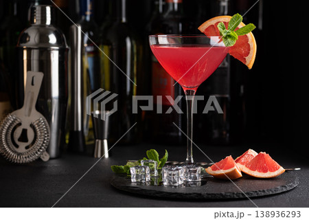 Martini Fiero Cocktail with Grapefruit and Mint. Elegant Mixology Scene Martini Fiero Cocktail with Grapefruit and Mint. Elegant Mixology Scene 138936293