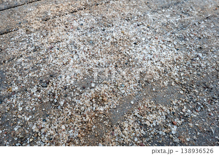 Sand and Salt Spread on Asphalt Surface for Winter Ice Safety Sand and Salt Spread on Asphalt Surface for Winter Ice Safety 138936526