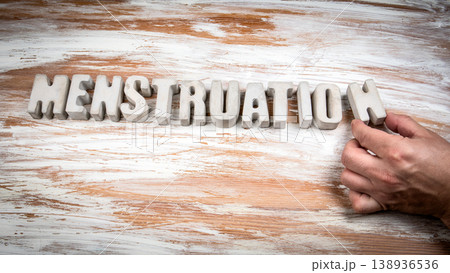 Menstruation Word Formed With Decorative Letters on Wooden Background 138936536