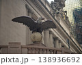 Bronze Eagle Watches Commuters Nearby. Guardian Eagle Sculpture Stands Tall Over City 138936692