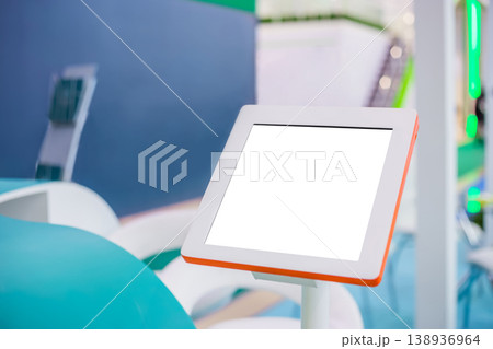 Electronic multimedia tablet kiosk with blank white display at exhibition 138936964