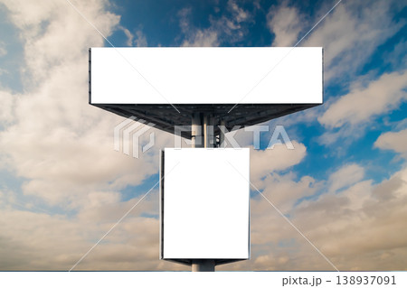 Front view: two blank white billboards against the blue sky with clouds: mock up Front view: two blank white billboards against the blue sky with clouds: mock up 138937091