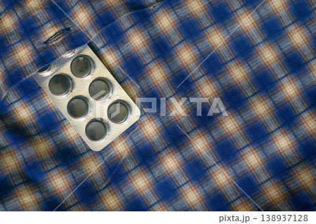 Help.Blister pack of medicinal capsules in a shirt pocket Help.Blister pack of medicinal capsules in a shirt pocket 138937128