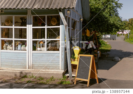 Inviting Rustic Market Stall with Blank Chalkboard Sign for Custom Message 138937144