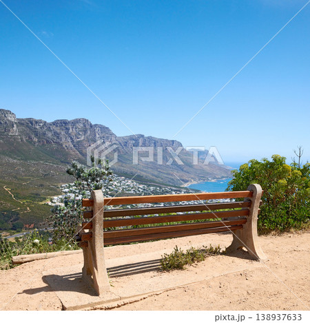 Bench with a beautiful view of the mountain and sea against a clear blue sky background with copy space. Landscape of relaxing outdoor seating on cliff to enjoy zen moment in Cape Town, South Africa Bench with a beautiful view of the mountain and sea against a clear blue sky background with copy space. Landscape of relaxing outdoor seating on cliff to enjoy zen moment in Cape Town, South Africa 138937633
