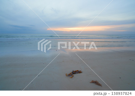 Seascape and landscape of a blue sunset on the west coast of Jutland in Loekken, Denmark. Beautiful cloudscape on an empty beach at dusk. Clouds over the ocean and sea in the evening with copyspace Seascape and landscape of a blue sunset on the west coast of Jutland in Loekken, Denmark. Beautiful cloudscape on an empty beach at dusk. Clouds over the ocean and sea in the evening with copyspace 138937824