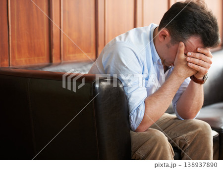 Sad, man and stress on sofa in waiting room with loss of job from mistake or failure. Businessman, crying and sitting on couch with fear of unemployment, anxiety or frustrated with problem at work Sad, man and stress on sofa in waiting room with loss of job from mistake or failure. Businessman, crying and sitting on couch with fear of unemployment, anxiety or frustrated with problem at work 138937890