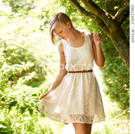 Summer, walking and forest with woman, sunshine and thinking with fun, fresh air and wellness. Person, outdoor and girl in the woods, park or trees with sunlight, carefree or dress with joy or nature Summer, walking and forest with woman, sunshine and thinking with fun, fresh air and wellness. Person, outdoor and girl in the woods, park or trees with sunlight, carefree or dress with joy or nature 138937902