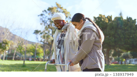 Senior care, old woman with walker and nurse in park with support, help or trust at nursing home. Retirement healthcare, elderly person and happy caregiver walk and talk in garden together with smile 138937949