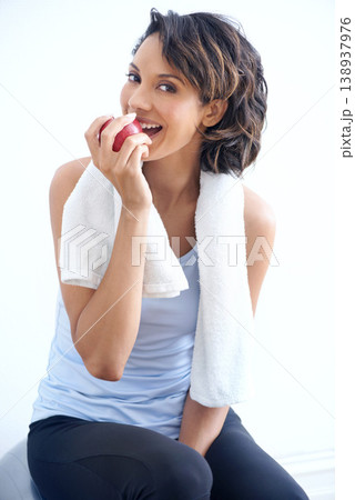 Fitness, studio and portrait of happy woman with apple, smile and healthy breakfast diet for weight loss. Nutrition, detox and exercise, face of girl eating fruit on white background for wellness. Fitness, studio and portrait of happy woman with apple, smile and healthy breakfast diet for weight loss. Nutrition, detox and exercise, face of girl eating fruit on white background for wellness. 138937976