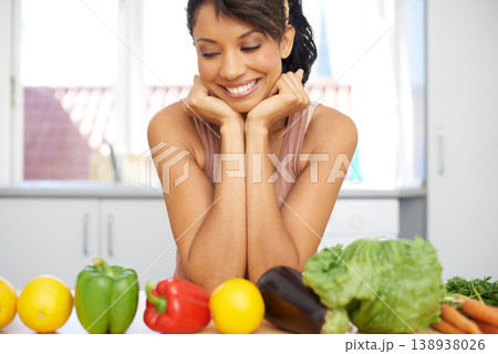 Happy woman, vegetables and line in kitchen for meal preparation, fresh produce or diet at home. Female person or vegan smile for natural organic food, row or nutrition in health or wellness at house 138938026