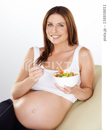Portrait, salad and pregnant with woman, vitamins and smile on a white studio background. Person, bowl and model with happiness, girl or pregnancy with vegetables, relax or maternal with healthy meal Portrait, salad and pregnant with woman, vitamins and smile on a white studio background. Person, bowl and model with happiness, girl or pregnancy with vegetables, relax or maternal with healthy meal 138938051