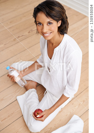Water, fruit and yoga portrait of happy woman in gym for fitness, health and wellness from above. Relax, diet and smile, girl in floor workout for balance, body care or pilates with apple and bottle Water, fruit and yoga portrait of happy woman in gym for fitness, health and wellness from above. Relax, diet and smile, girl in floor workout for balance, body care or pilates with apple and bottle 138938084