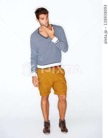 Handsome, portrait and a man with fashion on a white background for style, trendy and cool. Unique, stylish and a confident guy or model with clothes, shorts or casual clothing on a studio backdrop 138938093