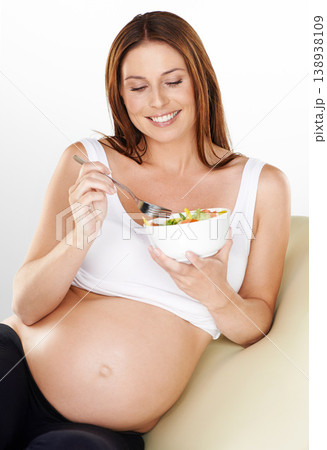 Relax, salad and pregnant with woman, smile and healthy food on a white studio background. Person, bowl and model with happiness, wellness or pregnancy with vegetables, vitamins or maternal with meal Relax, salad and pregnant with woman, smile and healthy food on a white studio background. Person, bowl and model with happiness, wellness or pregnancy with vegetables, vitamins or maternal with meal 138938109