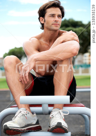 Man, thinking and planning for fitness strategy, ideas and vision for workout, exercise and growth. Male athlete, sitting and training for marathon, body building and race with outdoor equipment Man, thinking and planning for fitness strategy, ideas and vision for workout, exercise and growth. Male athlete, sitting and training for marathon, body building and race with outdoor equipment 138938139