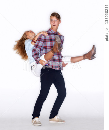 Portrait, funny couple and piggyback in studio isolated on a white background mockup space. Excited, happy man carrying woman and ride, play and smile together for love, bonding and laugh for freedom 138938235