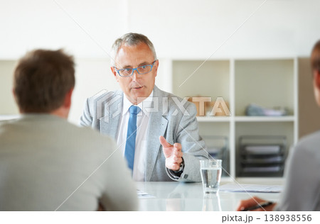 Meeting, people and mature lawyer with advice in office for legal consulting and feedback for clients, Businessman, talking and attorney in negotiation debate and professional advocate in law firm Meeting, people and mature lawyer with advice in office for legal consulting and feedback for clients, Businessman, talking and attorney in negotiation debate and professional advocate in law firm 138938556