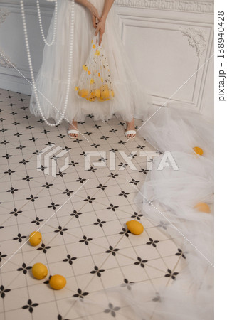 Bride With Citrus. Elegant Bride Holding Lemons. Minimalist Bride Surrounded By Citrus And Pearls 138940428