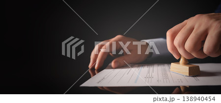Businessman working in office with stamp Businessman working in office with stamp 138940454