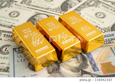 Gold bar on US dollar and Euro banknote, economy finance exchange trade investment. Gold bar on US dollar and Euro banknote, economy finance exchange trade investment. 138942383