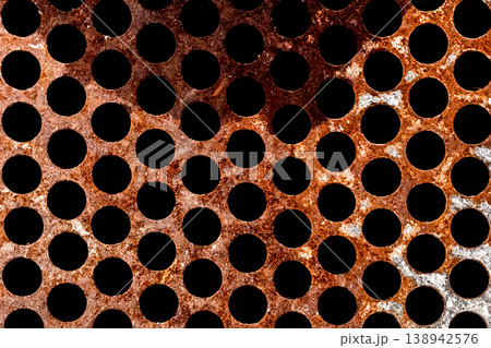 Metal old steel rusty brown texture round patterns holes circle iron dirty abstract background structure rust Metal old steel rusty brown texture round patterns holes circle iron dirty abstract background structure rust 138942576