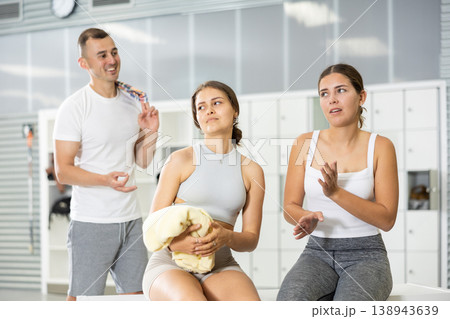 Girls rejecting attempt of guy to chat in gym locker room Girls rejecting attempt of guy to chat in gym locker room 138943639