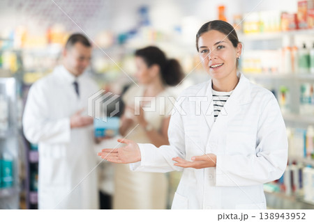 Female pharmacist in medical uniform posing while working in pharmacy 138943952