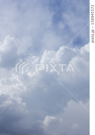 It's a blue sky with atmospheric puffy clouds. It's a blue sky with atmospheric puffy clouds. 138945572