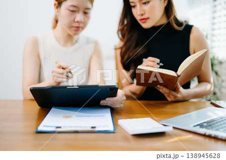 Business team meeting. professional investor working new start up project. Finance task. with smart phone and laptop and digital tablet computer Business team meeting. professional investor working new start up project. Finance task. with smart phone and laptop and digital tablet computer 138945628
