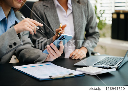 Team business meeting presentation. Hand businessman working project in modern office.Laptop computer and tablet and smart phone Team business meeting presentation. Hand businessman working project in modern office.Laptop computer and tablet and smart phone 138945720