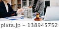 Professional business meeting with real estate models, legal consulting, contract discussion and corporate negotiation for investment and property management 138945752