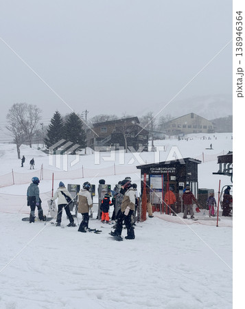 Niseko, Japan - April 3, 2025 : Snowboarders and skiers enjoy activities at Annupuri ski resort, Niseko, Hokkaido, Japan on April 3, 2025. 138946364