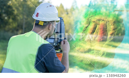 An engineer at work on a geodetic instrument. Geodesy surveying is the cadastral work of performing measurements of premises using a modern total station geodetic instrument. An engineer at work on a geodetic instrument. Geodesy surveying is the cadastral work of performing measurements of premises using a modern total station geodetic instrument. 138948260