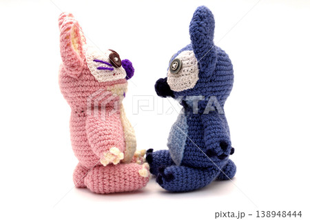 Knitted wool aliens on a white background Knitted wool aliens on a white background 138948444